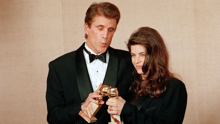 Actors Ted Danson and Kirstie Alley touch their awards together backstage at the 48th Annual Golden Globe Awards in Beverly Hills, Calif., Jan. 19, 1991. Danson and Alley won for best actor and best actress in a television comedy for their work on "Cheers."