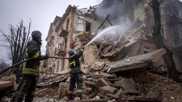 Ukrainian State Emergency Service firefighters work to extinguish a ...