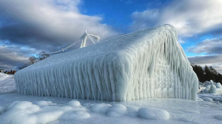 Lake Michigan waves cover shop in ice 

