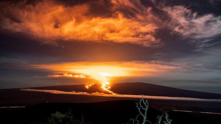 Lava fountains and flows illuminate the area during the Mauna Loa volcano eruption in Hawaii