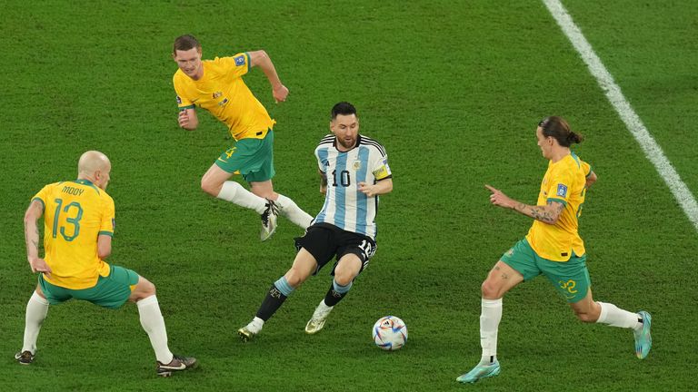 Argentina&#39;s Lionel Messi (centre) battle for the ball with Australia&#39;s Jackson Irvine (right)