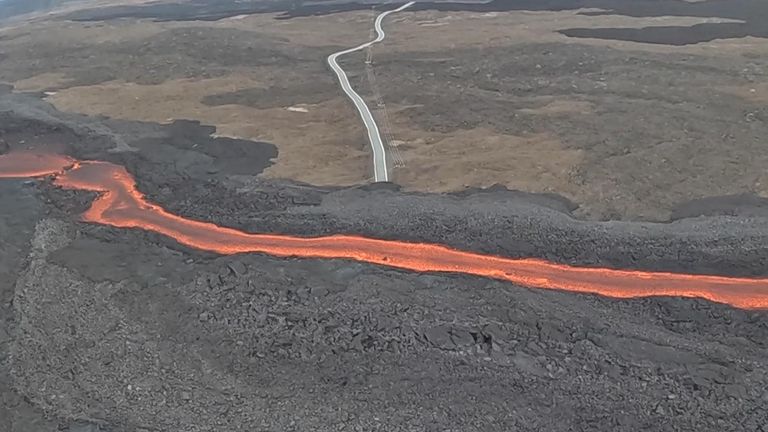 Mauna Loa&#39;s lava flows across a road in Hawaii