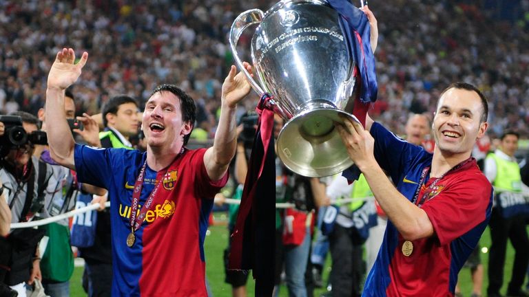  In this May 27, 2009, file photo, Barcelona's Andres Iniesta, right, and Lionel Messi hold the trophy at the end of the UEFA Champions League final soccer match between Manchester United and Barcelona in Rome. Xavi Hernandez, Andres Iniesta or Lionel Messi will win FIFA's Ballon d'Or trophy as the world's best player on Monday, and much of the teammates' success can be attributed to Barcelona's La Masia youth academy. (AP Photo/Manu Fernandez)