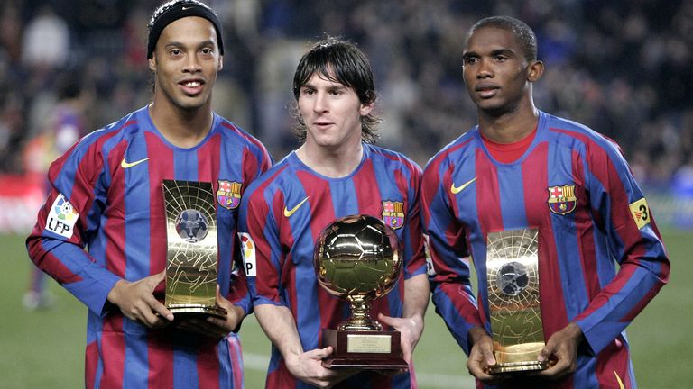 Barcelona&#39;s Brazilian soccer player Ronaldinho, left, and Samuel Eto&#39;o, from Cameroon, right, show their FIFA world player trophies and Argentinean Leo Messi, center, with his Golden Boy Trophy before their Spanish League soccer match against Celta Vigo at Nou Camp Stadium in Barcelona, Spain, Tuesday Dec. 20, 2005. (AP Photo/Manu Fernandez)