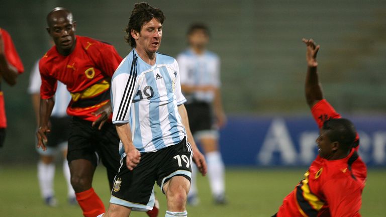 In this May 30, 2006, file photo, Argentina&#39;s Lionel Messi dribbles past an unidentified Angola player during an exhibition soccer match in Salerno, Italy. In Spain, young soccer players can sign professional contracts when they turn 16, the minimum work age stipulated by Spanish law. Before that, children join training academies run by soccer clubs that field youth teams in amateur leagues. The most well-known example in Spain is Barcelona&#39;s "La Masia" academy