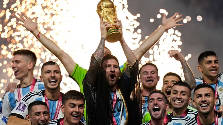 Argentina's Lionel Messi lifts the trophy after winning the World Cup final.  Photo: AP