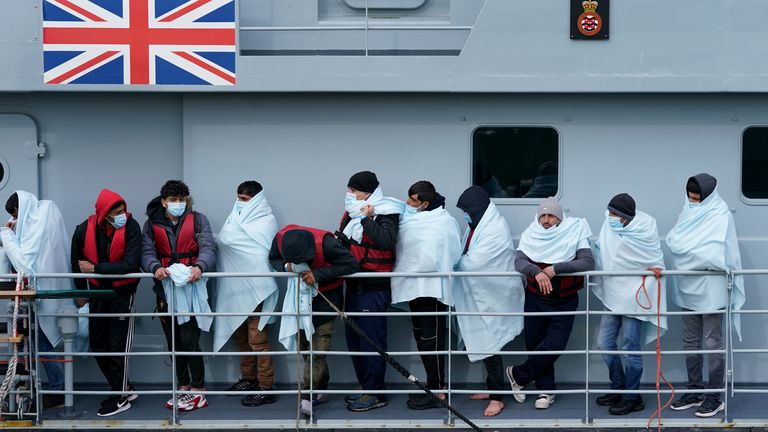 PA REVIEW OF THE YEAR 2022 File photo dated 15/03/22 - A group of people thought to be migrants are brought in to Dover, Kent, onboard a Border Force vessel following a small boat incident in the Channel. Issue date: Tuesday December 20, 2022.

