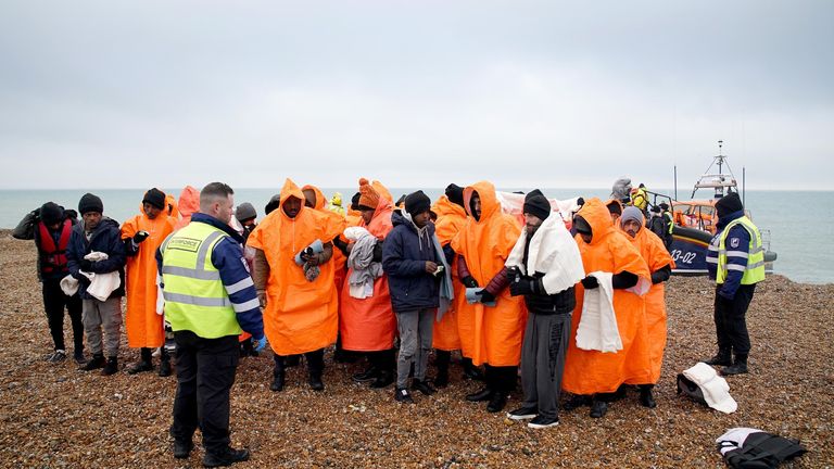 A group of people thought to be migrants are brought in to Dungeness, Kent, after being rescued by the RNLI following a small boat incident in the Channel. Picture date: Friday December 9, 2022.