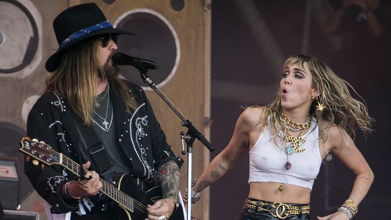 Singers Miley Cyrus, right, and her father Billy Ray Cyrus perform at Glastonbury. Pic: Joel C Ryan/Invision/AP                                                                                                                                  