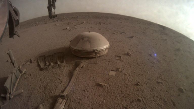 This image released by NASA on Monday, Dec. 19, 2022, shows NASA...s InSight lander on Mars. The lander...s power levels have been dwindling for months because of all the dust coating its solar panels. While ground controllers at California&#39;s Jet Propulsion Laboratory knew the end was near, they did not expect InSight to fall silent over the weekend. (NASA via AP)