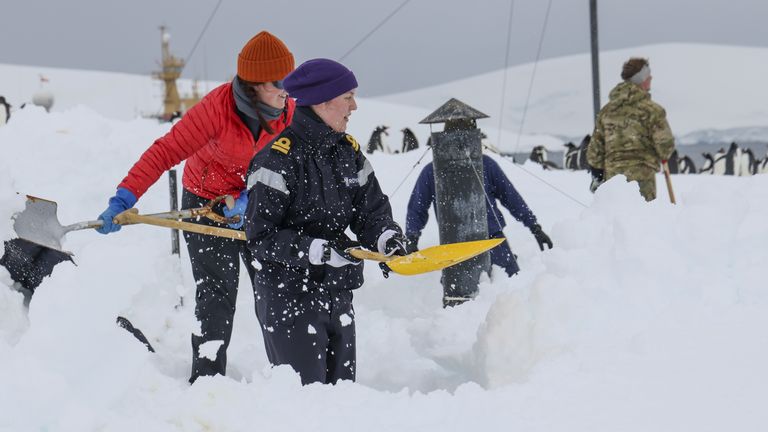 Embargoed until Saturday 3 December 2230 An undated handout photo released by the Ministry of Defense of HMS Protector's Company and the UKAHT team working together in Port Rockroy, Antarctica. Royal Navy sailors have come to the aid of four women working at a remote Antarctic science base after snow buried some buildings. Release date: Saturday, December 3, 2022.