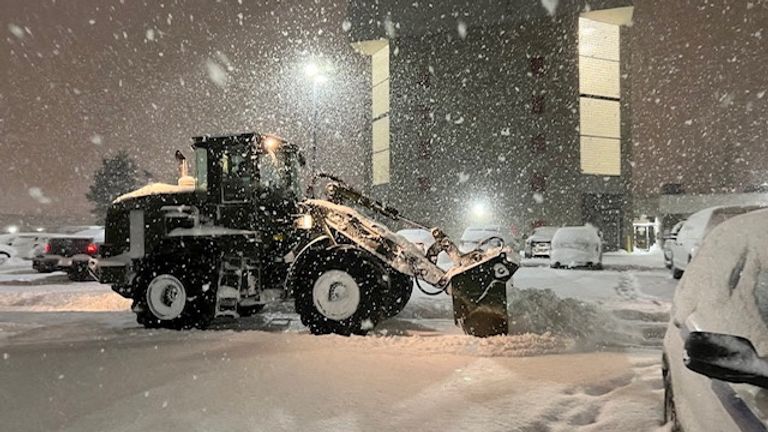 A New York Army National Guard soldier uses a front-end loader to clear snow from a parking lot in Cheektowaga, New York, December 26, 2022, in this handout via REUTERS via New York National Guard/Handout. This image is provided in Fig.  Through a third party.  Compulsory credit.  No resales.  No archives.