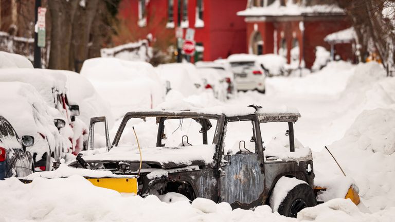 A Jeep which caught fire while plowing remains abandoned on road following a winter storm in Buffalo, New York, U.S., December 27, 2022. REUTERS/Lindsay DeDario
