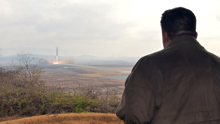 North Korean leader Kim Jong Un watches the launch of an intercontinental ballistic missile