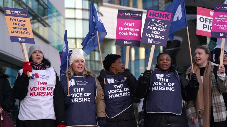 Members of the Royal College of Nursing (RCN) on the picket line outside the Queen Elizabeth Hospital, Birmingham