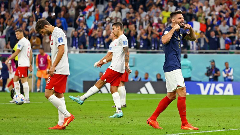 Oliver Giroud sticks his tongue out as France claims a second goal, scored by Kylian Mbappe 