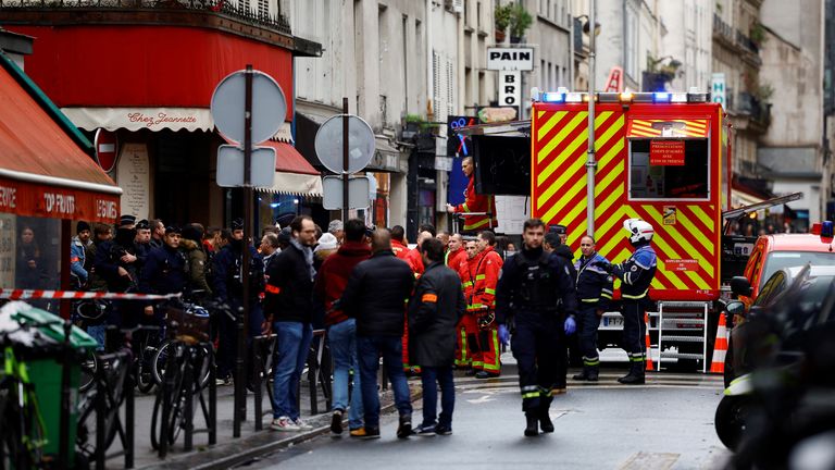 French police and firefighters secure a street after gunshots were fired killing two people and injuring several in a central district of Paris, France, December 23, 2022. REUTERS/Sarah Meyssonnier
