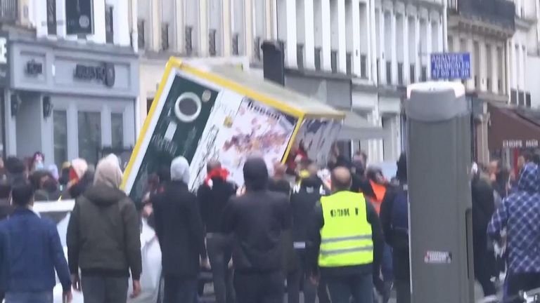 Protesters clashed with Paris police during a demonstration after three people were shot dead at a Kurdish cultural center.