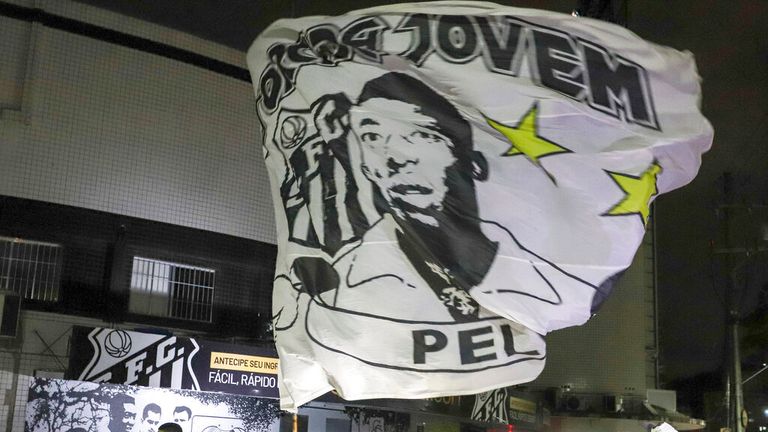 Santos supporters and Pele fans in front of the Vila Belmiro stadium, where he began his football career at the age of 15, playing for the home team. Pic: AP