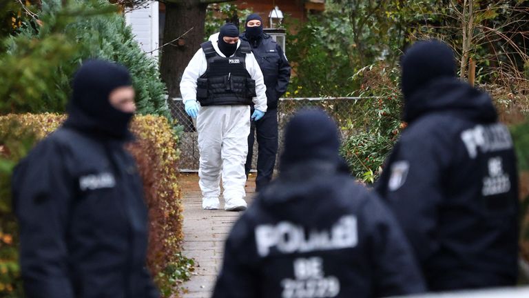 Police secures the area after 25 suspected members and supporters of a far-right group were detained during raids across Germany, in Berlin