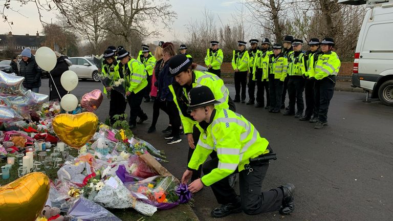 21 Officers from West Midlands Police lay bouquets of flowers and stood in silence near to the scene in Babbs Mill Park in Kingshurst, Solihull,  