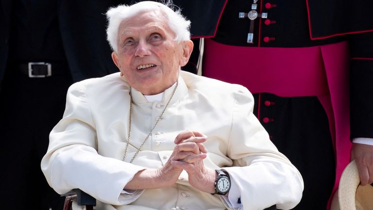 Pope Emeritus Benedict XVI gestures at Munich Airport before departing for Rome