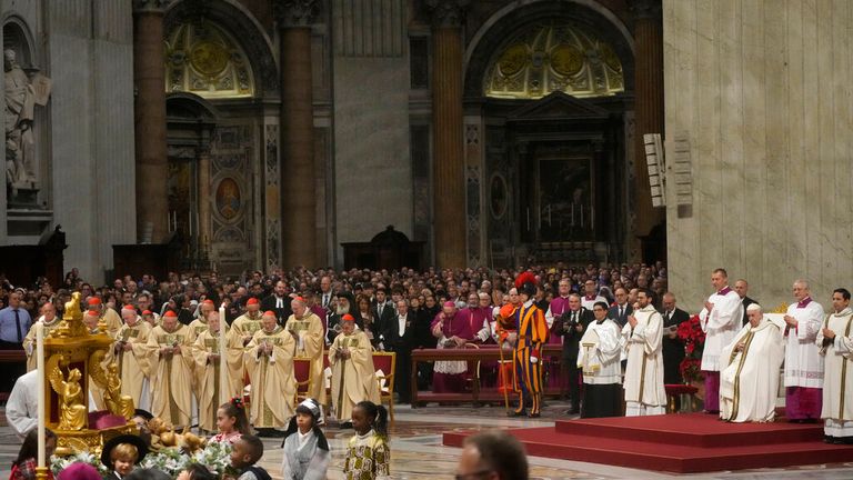 Pope Francis, third right, presides over Christmas Eve Mass, at St. Peter&#39;s Basilica at the Vatican, Saturday Dec. 24, 2022. (AP Photo/Gregorio Borgia)