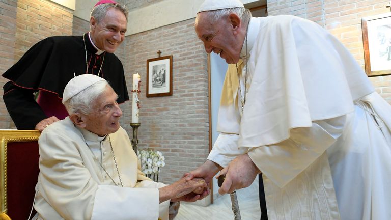 Pope Francis and Pope Emeritus Benedict XVI attend a meeting at the Vatican on August 27, 2022, the day of a permanent ceremony to raise Roman Catholic prelates to the rank of cardinal.