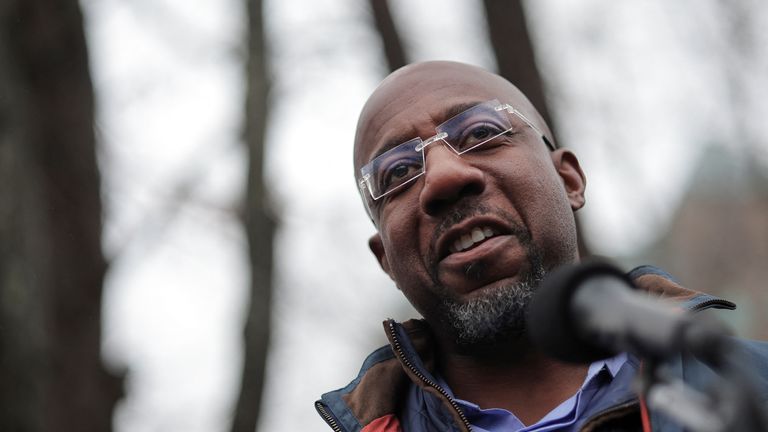 Reverend Raphael Warnock, Democratic Senator for Georgia, delivers remarks during a visit at a campaign office during the midterm Senate runoff elections in Norcross, Georgia, U.S., December 6, 2022. REUTERS/Carlos Barria