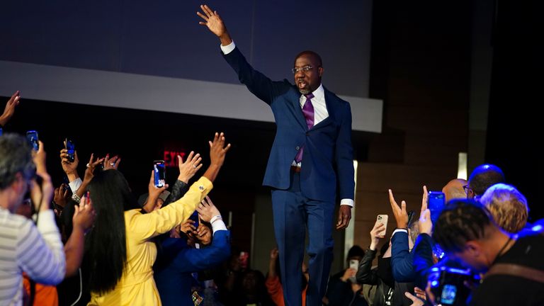 Democratic Sen. Raphael Warnock speaks during an election night watch party, Tuesday, Dec. 6, 2022, in Atlanta. Sen. Warnock has defeated Republican challenger Herschel Walker in a runoff election in Georgia. (AP Photo/John Bazemore)