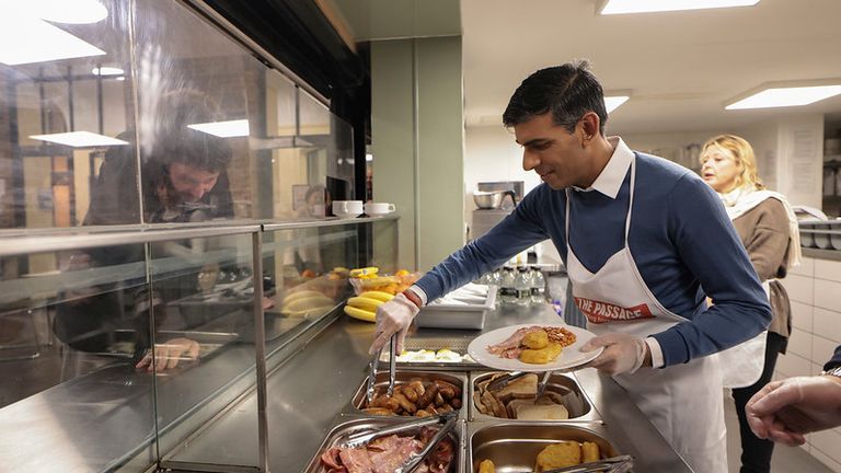 Prime Minister Rishi Sunak prepares and serves breakfast as he visits The Passage homeless shelter in London