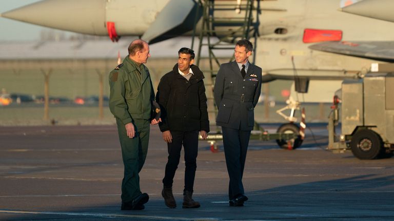 Air Chief Marshal Mike Wigston (left) and Station Commander for RAF Coningsby Billy Cooper (right) with Prime Minister Rishi Sunak during his visit to RAF Coningsby in Linconshire following the announcement that Britain will work to develop next-generation fighter jets with Italy and Japan. The jets, called Tempest in the UK, are to take to the skies by 2035 and serve as a successor to the RAF Typhoon. Picture date: Friday December 9, 2022.