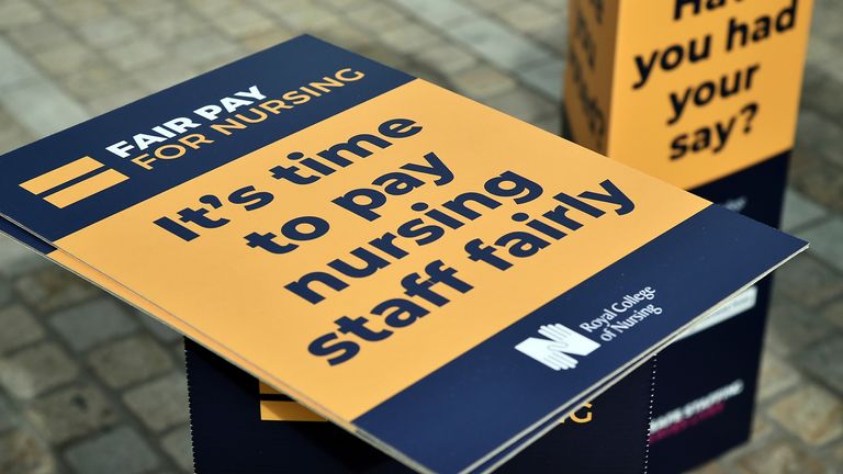 A view of signs from the Royal College of Nursing during a protest outside the Conservative Party conference at the ICC in Birmingham, England, Monday, Oct. 3, 2022. (AP Photo/Rui Vieira)