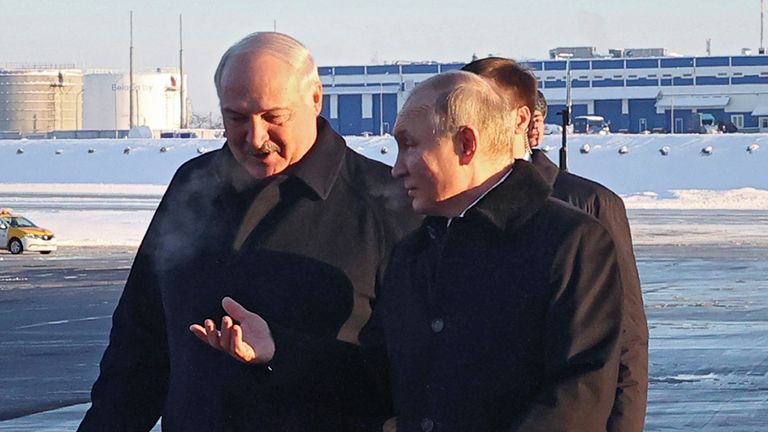 Russian President Vladimir Putin, right, talks with Belarusian President Aleksandr Lukashenko after arriving at Minsk National Airport in Minsk, Belarus, Monday, Dec. 12.  19th, 2022.  (Sergey Karpukhin, Sputnik, Kremlin pool photo via AP)
