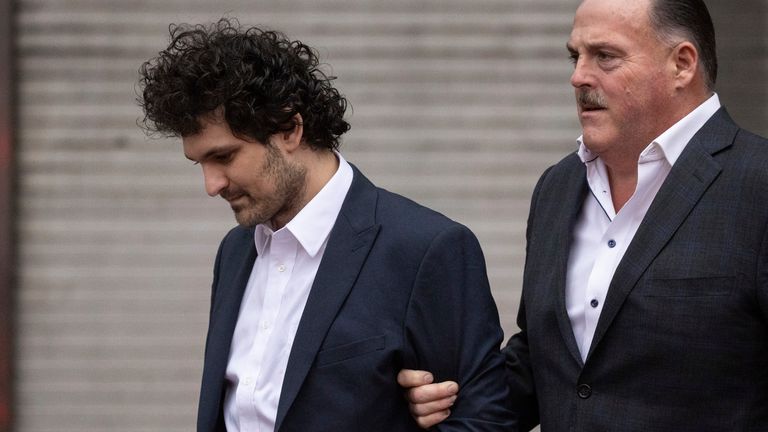 FTX founder Sam Bankman-Fried leaves court after being extradited to the US, Thursday, December 12.  22, 2022, New York.  Bankman-Fried's parents agreed to sign a $250 million bond and keep him in their California home while he awaits trial on charges of defrauding investors and robbing client deposits on his FTX trading platform.  (AP Photo/Yuki Iwamura)