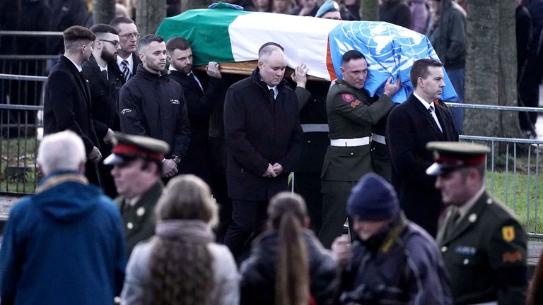 The coffin of Private Sean Rooney is carried into Holy Family Church, Dundalk, Co Louth for his funeral mass. Pte Rooney, 23, from Newtowncunningham in Co Donegal, was serving with a UN peacekeeping mission, when his convoy came under attack in Lebanon. Picture date: Thursday December 22, 2022.