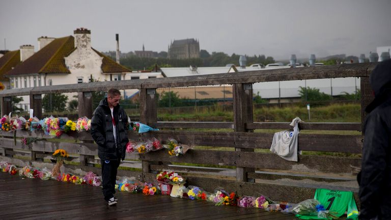 Floral tributes for those killed in the Shoreham Airshow crash on a footbridge in 2015