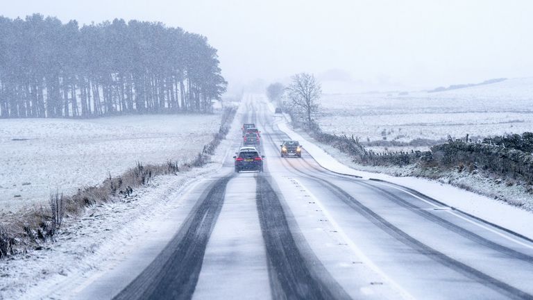 Traffic travels through snow along the A702 near Silverburn, Midlothian