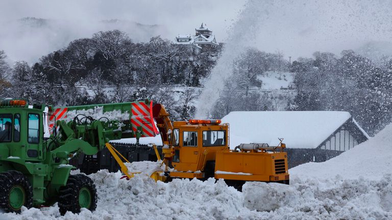 A snow-removing vehicle is operated in Ono, Fukui Prefecture on Dec. 24, 2022. 
