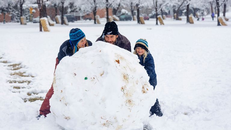 On Monday, December 12, Sal Wood, Blake Wood and 6-year-old Jacoby Wood rolled the biggest snowball at Camelback Park in Boise, Idaho. On December 12, 2022, up to 2.5 inches of snow fell overnight, according to the National Weather Service. There will be no more snow in the Boise area this week, but temperatures are expected to drop to 6 degrees by Saturday night.  (Sarah A. Miller/Idaho Statesman via AP)