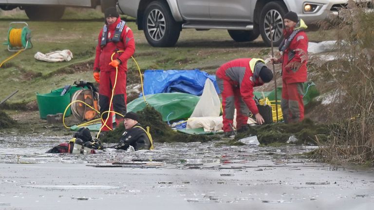 Police divers search the lake at Babbs Mill Park in Kingshurst, Solihull