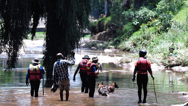 Rescue teams searching the Jukskei river in Johannesburg Pic: AP