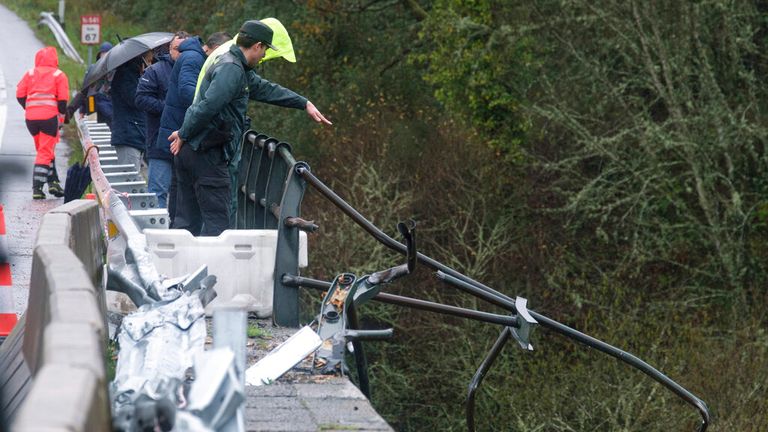 A civil guard where the bus fell into the river L..rez, on December 25, 2022, in the concello of Cerdedo-Cotobade, Pontevedra, Galicia, (Spain). Pic: Europa Press/AP