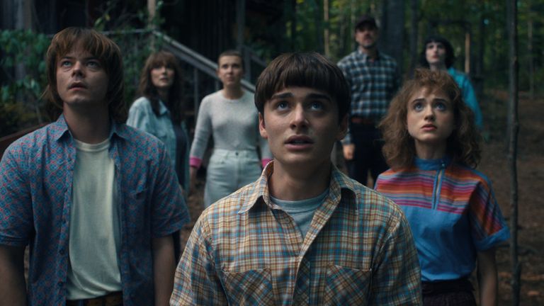 STRANGER THINGS.  (L to R) Charlie Heaton as Jonathan Byers, Winona Ryder as Joyce Byers, Millie Bobby Brown as Eleven, Noah Schnapp as Will Byers, David Harbor as Jim Hopper, Natalia Dyer as by Nancy Wheeler and Finn Wolfhard as Mike Wheeler in STRANGER THINGS .  Cr.  Courtesy of Netflix .. 2022