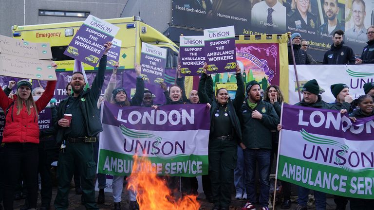 Ambulance workers on the fence outside Waterloo Ambulance Station in London