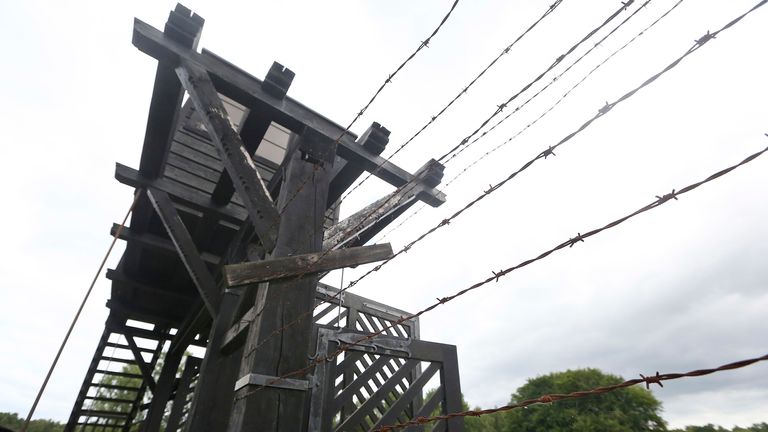 In this July 18, 2017 photo the wooden main gate leads into the former Nazi German Stutthof concentration camp in Sztutowo, Poland. A former SS guard is to go on trial in Germany on charges of accessory to murder for serving at the Nazis&#39; Stutthof concentration camp. The 94-year-old, who hasn&#39;t been identified due to German privacy laws, is accused of working as a guard at the camp from June 1942 to the beginning of September 1944. (AP Photo/Czarek Sokolowski)


