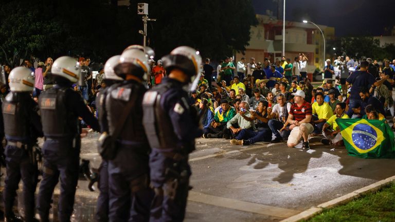 Supporters of Brazil&#39;s President Jair Bolsonaro protest after supreme court justice Alexandre de Moraes ordered a temporary arrest warrant of indigenous leader Jose Acacio Serere Xavante for alleged anti-democratic acts, in Brasilia, Brazil
