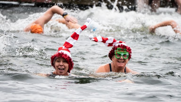 Members of the Serpentine Swimming Club take part in the Peter Pan Cup race, which is held every Christmas Day at the Serpentine, in central London. Picture date: Sunday December 25, 2022.