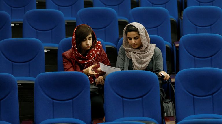 Female students from the American University of Afghanistan attend new orientation sessions at an American university in Kabul
