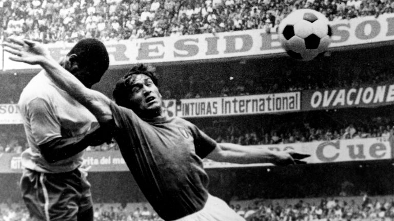 Pelé heads the ball past Italy's Tarcisio Burgnich to score in the 1970 World Cup final. Photo: AP